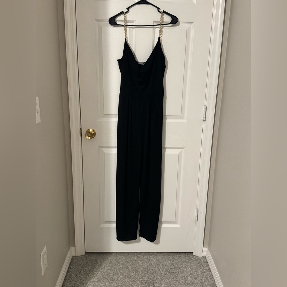 Black jumpsuit with gold chain straps!